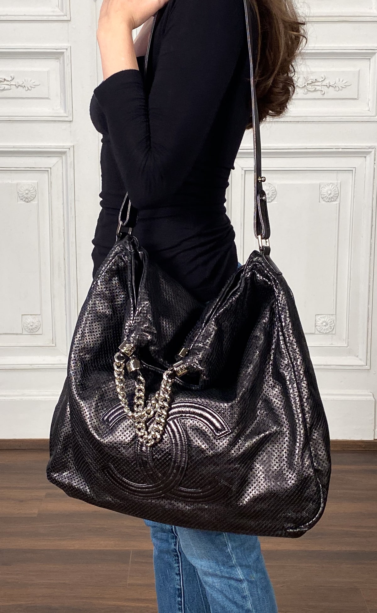 Chanel Rodeo Drive Perforated Bag: Chanel Rodeo Drive Perforated Bag, Black Leather And Silver Tone Hardware, Date Code Sticker Indicates 2008 Production, Height 20 In, Width16.5 In, Depth 3.5 In, Shoulder Strap Drop 10.5 In, Handle