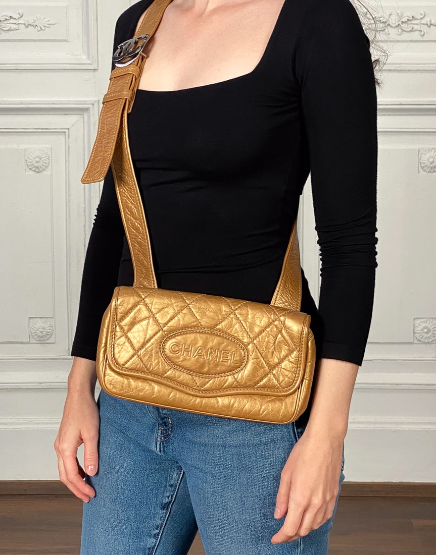 Chanel Gold Crossbody Belt Bag: Chanel Gold Crossbody Belt Bag, Gold Metallic Distressed Leather, Silver Tone Hardware, Date Code Sticker Indicates 2005-2006 Production, Height 5, Width 9.5, Depth 2 Inches, Wear To Corners,