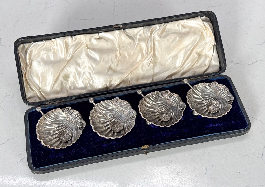 Four English Sterling Silver Salt Shells: Four English Sterling Silver Salt Shells, 1894, Chester, Rampant Lion, Shield And Date Assay Marks, James Deakin & Sons Marks, Each Open Shell Form With Conforming Spoons, Twist Handles, Width 2