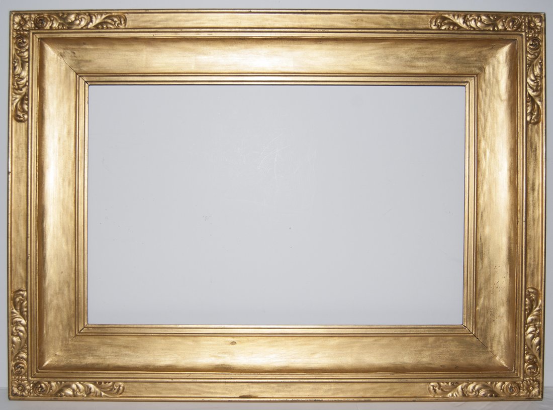 American Arts and crafts frame: American 20th C. hand carved and gilded and gilded cassetta cove frame with applied corners 16 x 24 W: 4.5