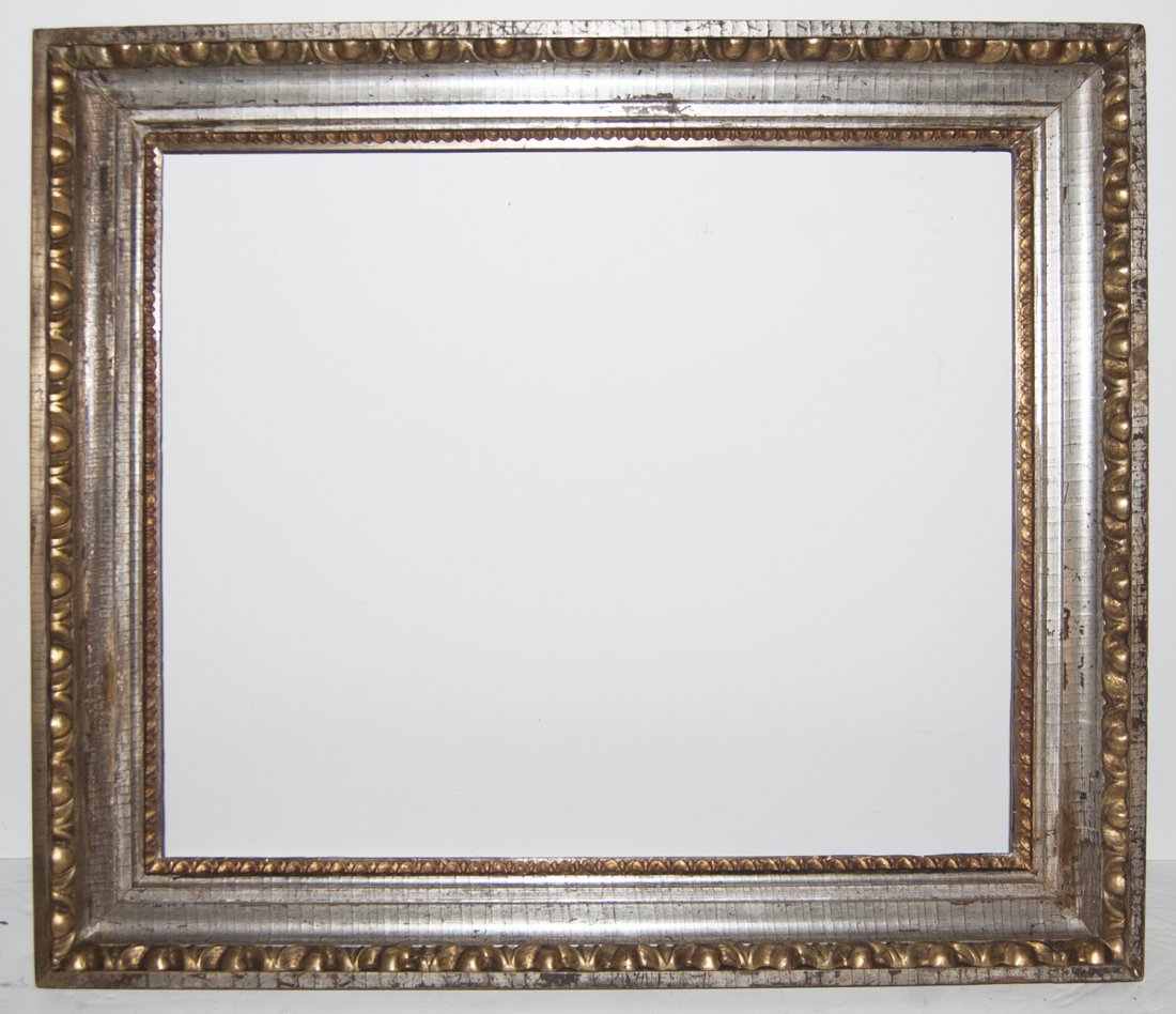 European 18th C. silver cove frame: European 18th C. hand carved and applied silver gilded frame with egg and dart motif 20 x 23 W: 3
