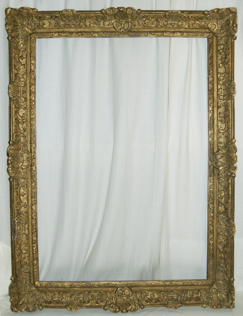 Large French Louis XIV frame: Large French Louis XIV carved and gilded frame with corner and centre cartouches and sand frieze. 34 x 48 W: 5