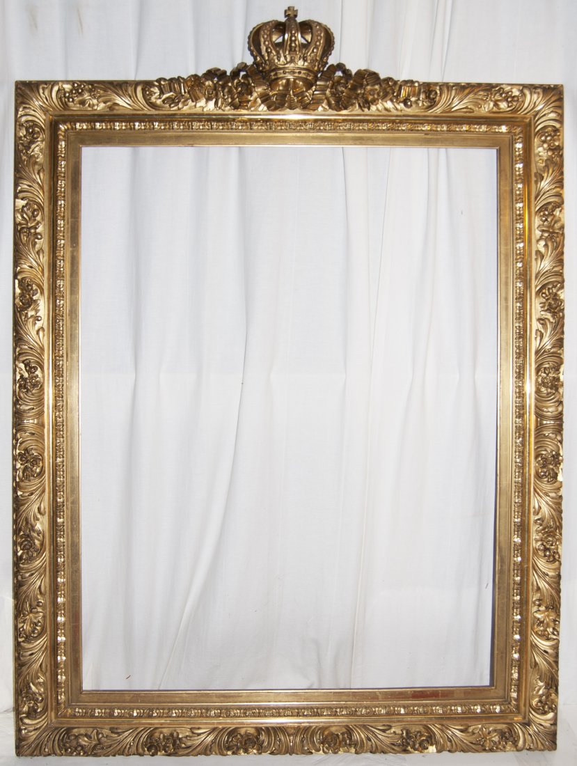 Large European frame with Crown Motif: Large European 18th / 19th C. hand carved and gilded ornate frame with leaf twist and Royal Crown motif. 35 x 46 W: 6