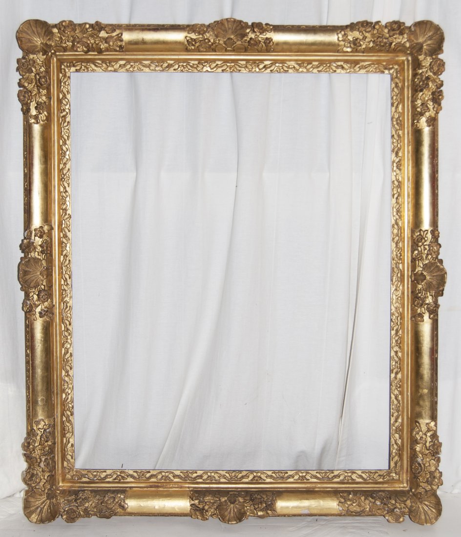 French Louis XIV hand carved and gilded frame: French Louis XIV hand carved and gilded frame with flower and shell motifs. 30 x 37 W: 4.5