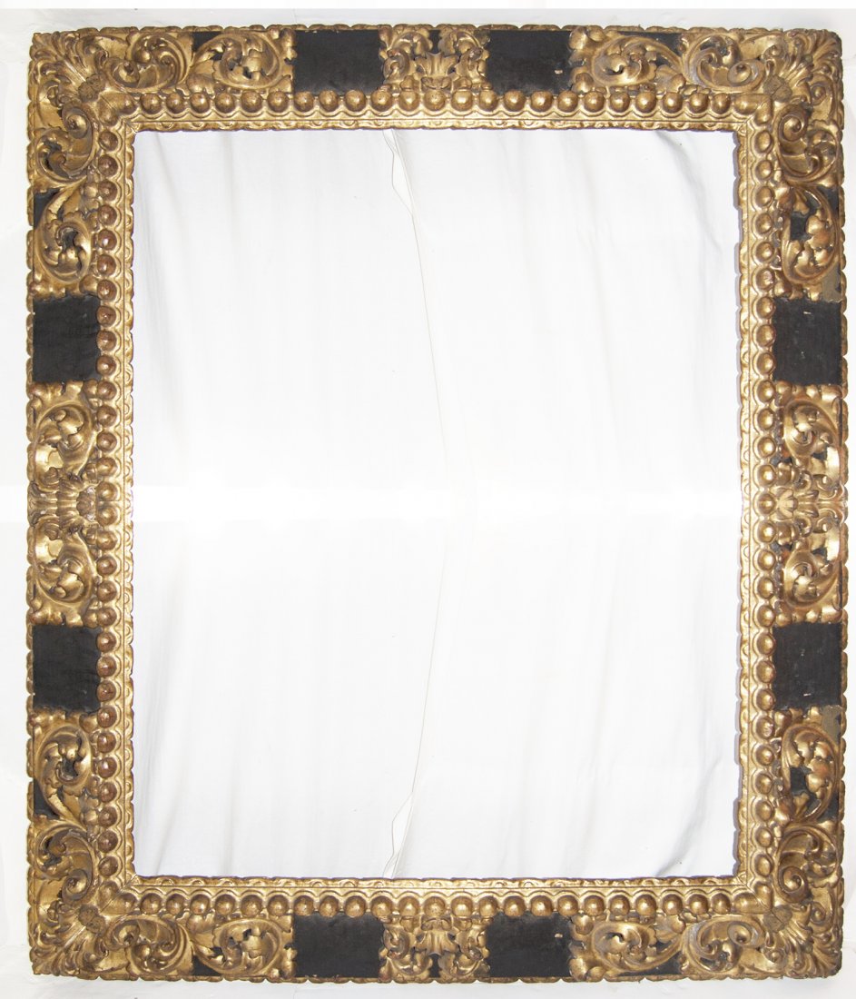 Very large Spanish 17th C. hand carved and gilded frame: Very large Spanish 17th C. hand carved, gilded and polychromed frame with reverse hollow and pronounced leaf corner and centers 42 x 51 W: 8