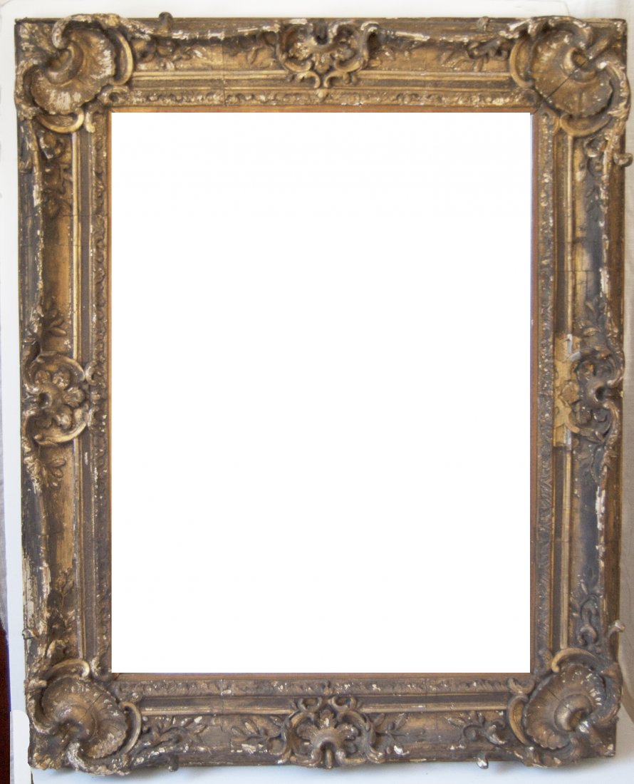 French 18th C. Louis XV hand carved and gilded frame: French 18th C. Louis XV hand carved and gilded frame with corner shells Canvas that frame will accommodate: 26 x 35 Frame width: 6