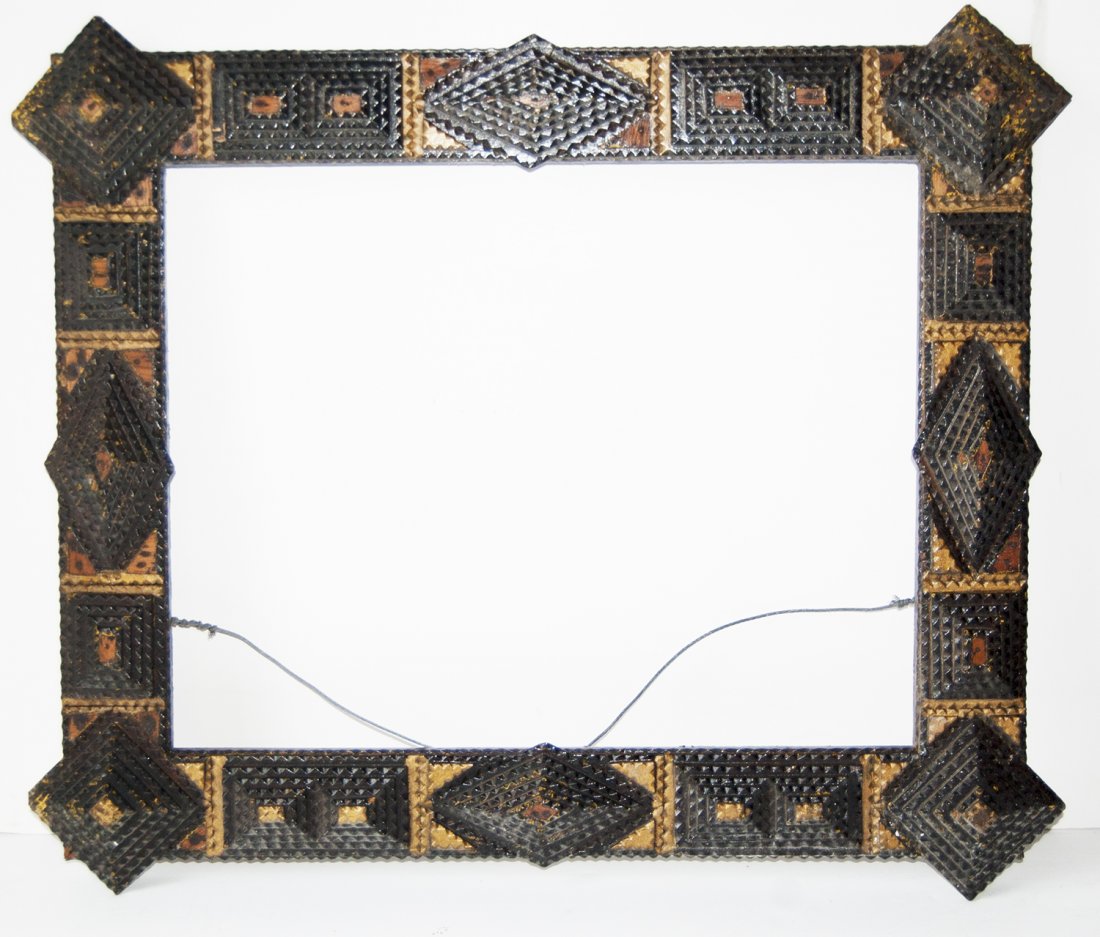 American 19th C. appiled carved wood Tramp Art frame: American 19th C. appiled carved wood Tramp Art frame.Canvas that frame will accommodate: 16 x 20 Frame width: 3 1/2