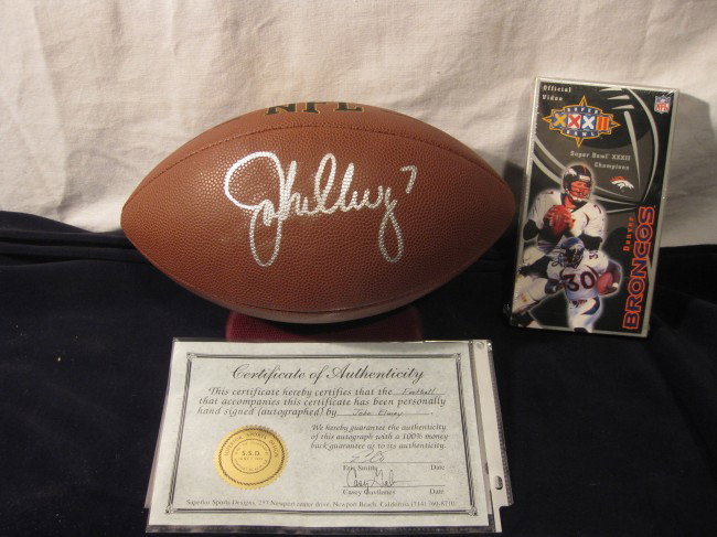 42- John Elway Autographed Football: 42- John Elway Autographed Football with certificate of authenticity Hall Of America- Includes VHS Super bowl XXXII Champions Denver Broncos