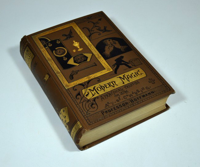 HOFFMANN, PROFESSOR. Modern Magic: HOFFMANN, PROFESSOR. Modern Magic. A Practical Treatise on the Art of Conjuring. Text woodcuts, over 317 figures. 563 pages. Thick 12mo, patterned illustrated brown cloth with gold decoration on front