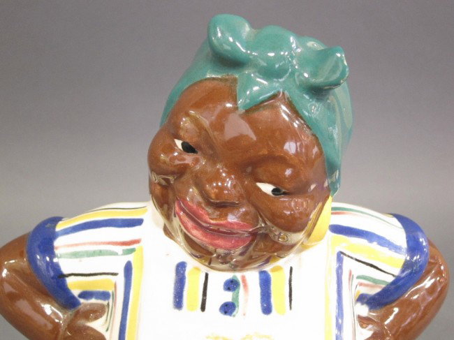 BRAYTON LAGUNA POTTERY COOKIE JAR: Figural with African American cook wearing an apron. Height 13.25"