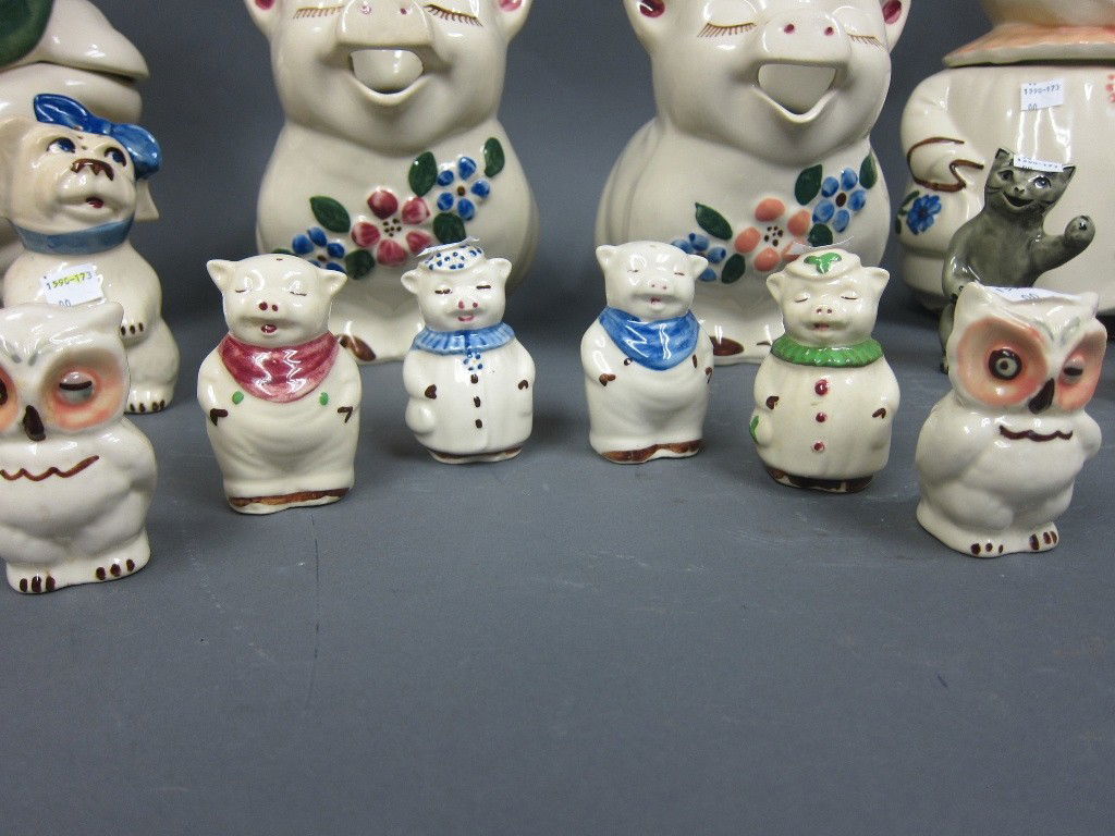GROUP VINTAGE COOKIE JARS, SHAKERS & PITCHERS: Animal form including pigs, bears, cats, owls, a duck and a baker.