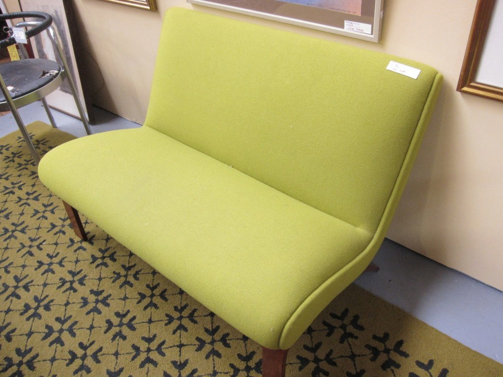 SETTEE: a 20th century modern design Avocado green upholstered settee by "Modernica, los angeles45" in length