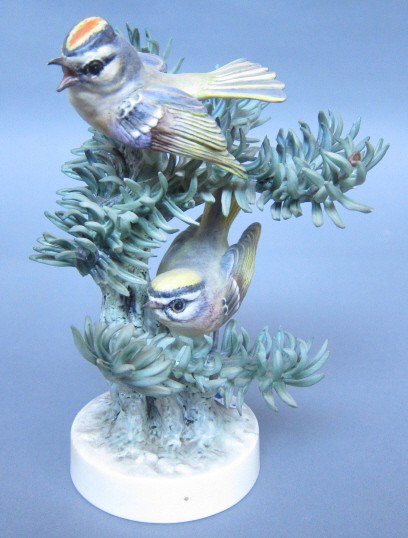 ROYAL WORCESTER D. DOUGHTY GOLDEN CROWNED KINGLET: Pair of birds. H. 7.5." Artist signed. With box. Note: two leaves chipped on the ends.