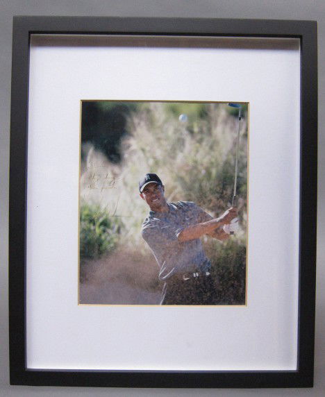 TIGER WOODS SIGNED COLOR PHOTOGRAPH: Signed and dedicated in pen at left. 9.5 x 7.75" sight.