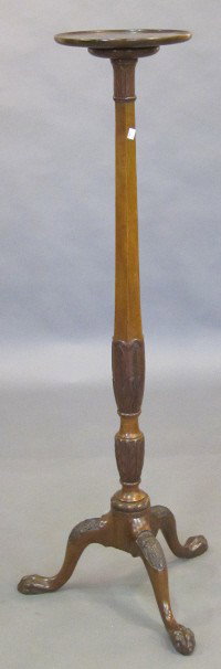 FERN STAND: A late 19th / early 20th C. English Edwardian George III style tall carved mahogany pedestal. The circular dish form top raised on an accathus leaf collard tapering hexogonal standard resting on tripo