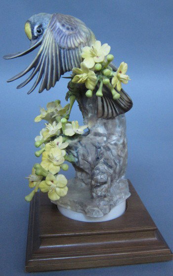 ROYAL WORCESTER D. DOUGHTY AUDUBON WARBLER HEN: With Palo Verde. 1963. H. 8." Artist signed. With box. Note: loose flower cluster, crack into the base.