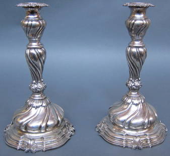 PAIR BUCCELLATI STERLING SILVER CANDLESTICKS: Baroque style with swirl support and base, raised on a stepped serpentine base with acanthus leaves. Marks on the bases 925, signed M. Buccellati.