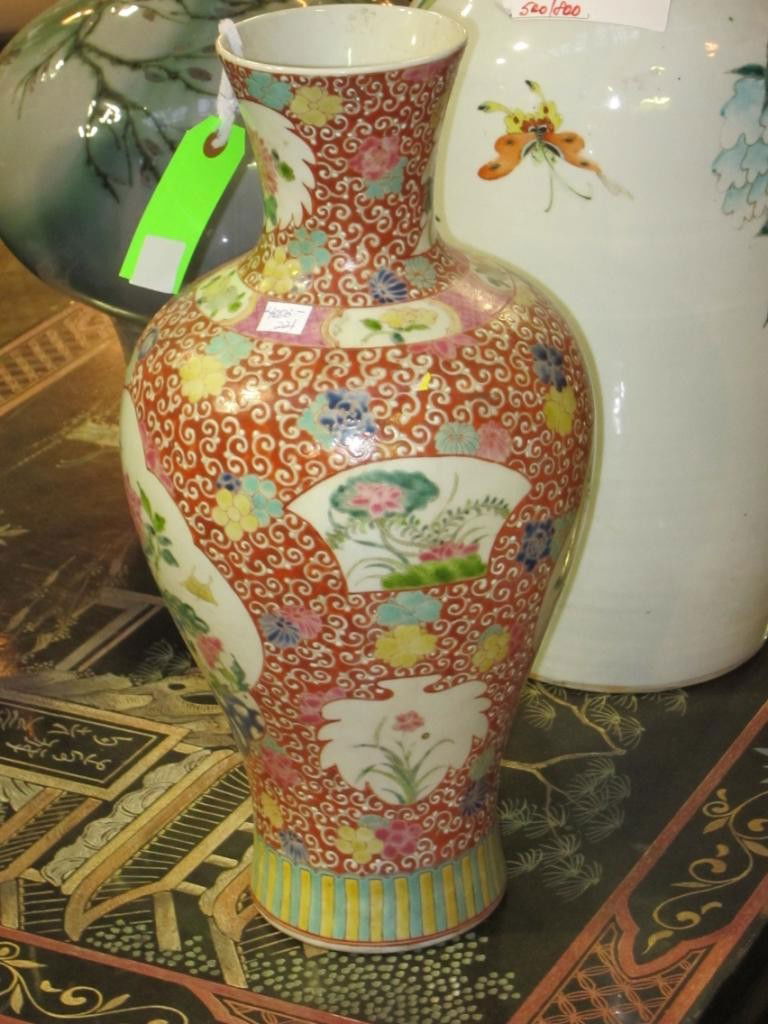 ANTIQUE CHINESE PORCELAIN VASE: Blue six character mark in double circles on the base. Red and white patterned ground with polychrome panels decorated with flowering branches and birds. H. 17."