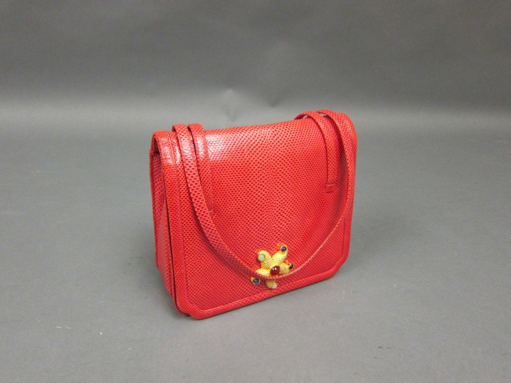 JUDITH LEIBER SKIN BAG SET: Red leather skin bag with semi-precious stones set on a starfish clasp. Double handles. 7.25 x 7.75" without handles.