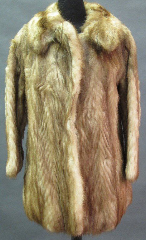 MINK FUR JACKET: Brown and white with notch collar and pockets on the seams. .
