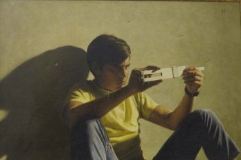 HOFFMAN, HELEN BACON (born 1930, American): Oil on canvas. Titled: "A Problem". Depicting a young man with a slide ruler. Signed upper right Hoffman. 20" H x 30" W Note: Minor puncture to canvas middle left. Provenance: Grand Central Art Galler