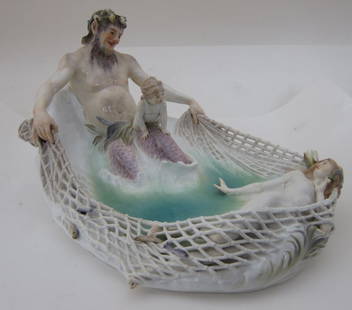 MEISSEN FIGURAL GROUP: An antique German Meissen polychrome porcelain group. Depicting Poseidon capturing a maiden in a fishing net. Bears blue crossed swords mark on bottom. 16" L x 11" W x 8" H Note: Some minor losses to