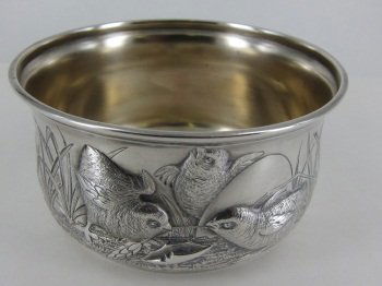 GEO. W. SCHIEBLER STERLING SILVER CHILDS BOWL: Having repousse design depicting chicks at play. Gold vermeil wash interior. Inscribed "Gordon Smith, May 12, 1886, from G. Warren Manning." Diam. 4.75," H.2.5" 5.8 Troy ounces.