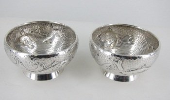 PAIR OF GORHAM STERLING MASTER SALTS: In an aquatic motif with swimming fish and ring bases. Monogrammed on the bases. Each 2.75" in diameter, 1.5" in height. 3.8 Troy ounces. Provenance: From the Fried Estate, Bedford NY Collectors for o