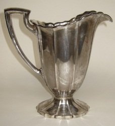 WATSON STERLING SILVER WATER PITCHER: Marked 8 pints. Scalloped form with angular handle. H. 10.25." 31.7 Troy ozs. Provenance: From the Fried Estate, Bedford NY Collectors for over 75 years.