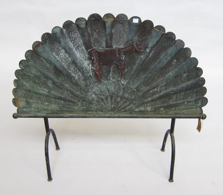 FIRE SCREEN: An unusual 19th C. copper hand hammered fan form footed firescreen. Repousse decorated depicting a donkey. 36 x 31.25"