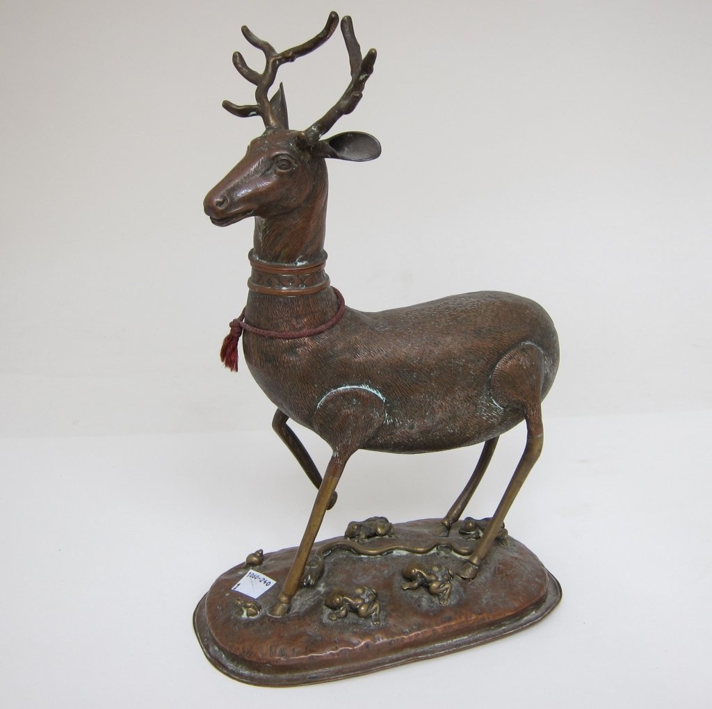 ANTIQUE COPPER STAG FIGURE: Hollow with removable head, standing on a base with brass frogs and serpent. L. 7.75, H. 12.75."