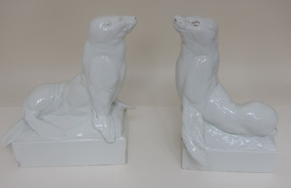 PAIR MEISSEN PORCELAIN SEAL FIGURES: Artist signed A. Gaul (August Gaul). White glazed porcelain seals on bases. Blue mark on the back of the bases, and incised mark with Weiss. H. 12.5, bases 9.5 x 5." Chips to the flippers and the base
