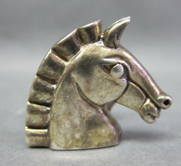 BARRY KIESELSTEIN CORD HORSE STERLING BELT BUCKLE: In the form of a horse head. Stamped marks with 1990 on the back. H. 1 3/8, W. 1 1/2." .65 Troy ozs.