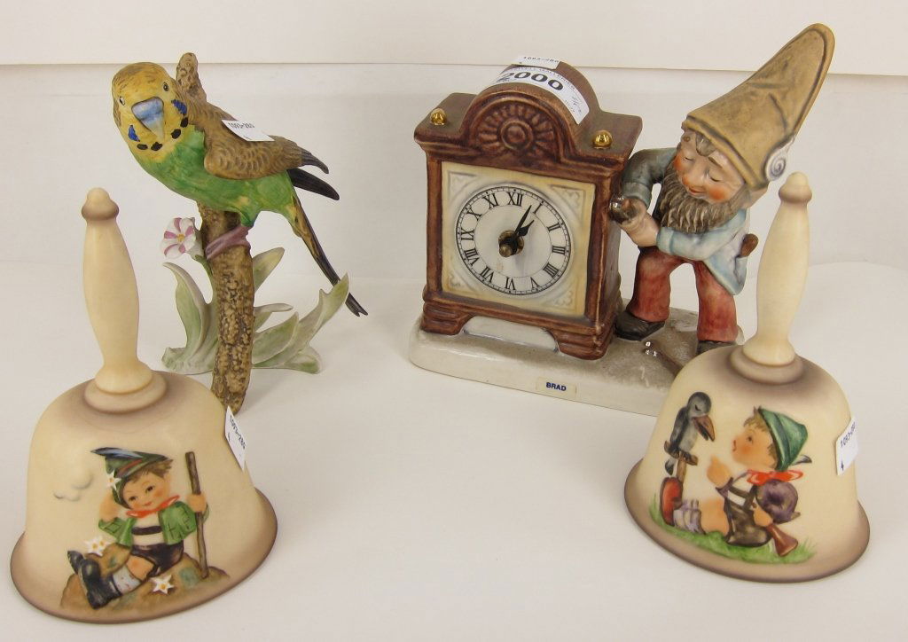 FOUR PCS. OF GOEBEL: Comprised of a gnome clock, two Hummel bells and a parakeet figure.