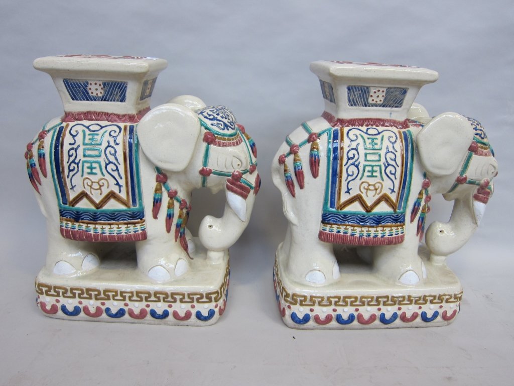 PAIR OF CHINESE GARDEN SEATS: 20th Century, Elephant form, Oriental ceramic in cream, cobalt, teal and rust tones. 24: H x 32" L