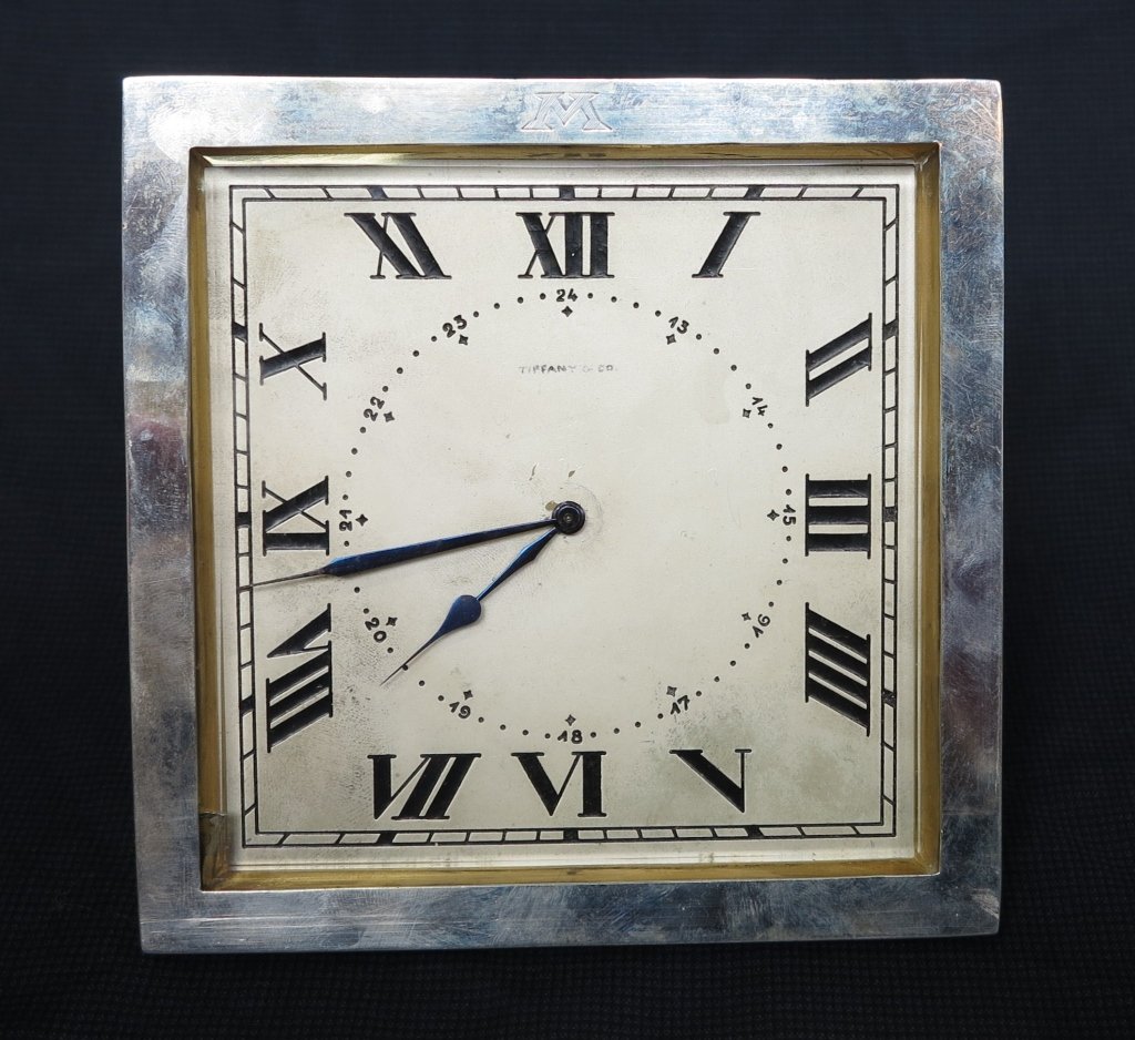 TIFFANY & CO. STERLING SILVER FRAMED TABLE CLOCK: Marked Swiss, Geneve 925. Monogrammed M. 6" sq.