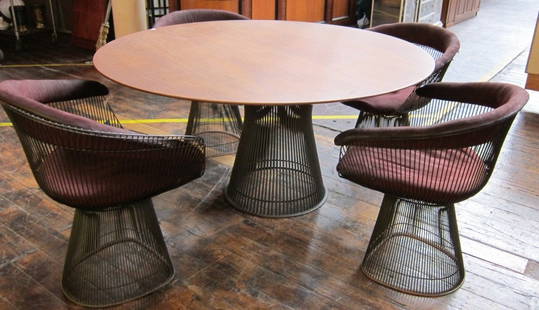 WARREN PLATNER (1919-2006, American): A mid 20th C. modern iconic sculptural steel wire dining table having a circular walnut top along with four matching steel wire framed chairs, each with removable seat cushions. The table