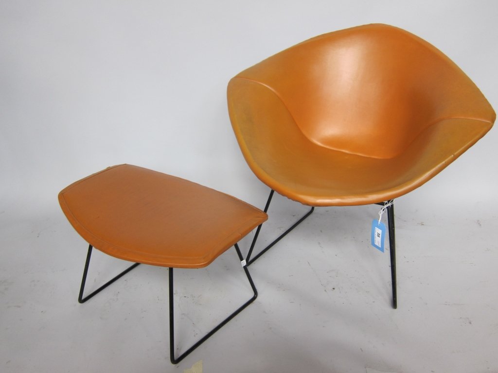 HARRY BERTOIA (1915-1978, Italian/American): The Diamond chair with matching ottoman for Knoll International. Black powder coated iron and iron wire frames fitted with brown leather stretch cushions. The first chair Harry Bertoia designed for Kn