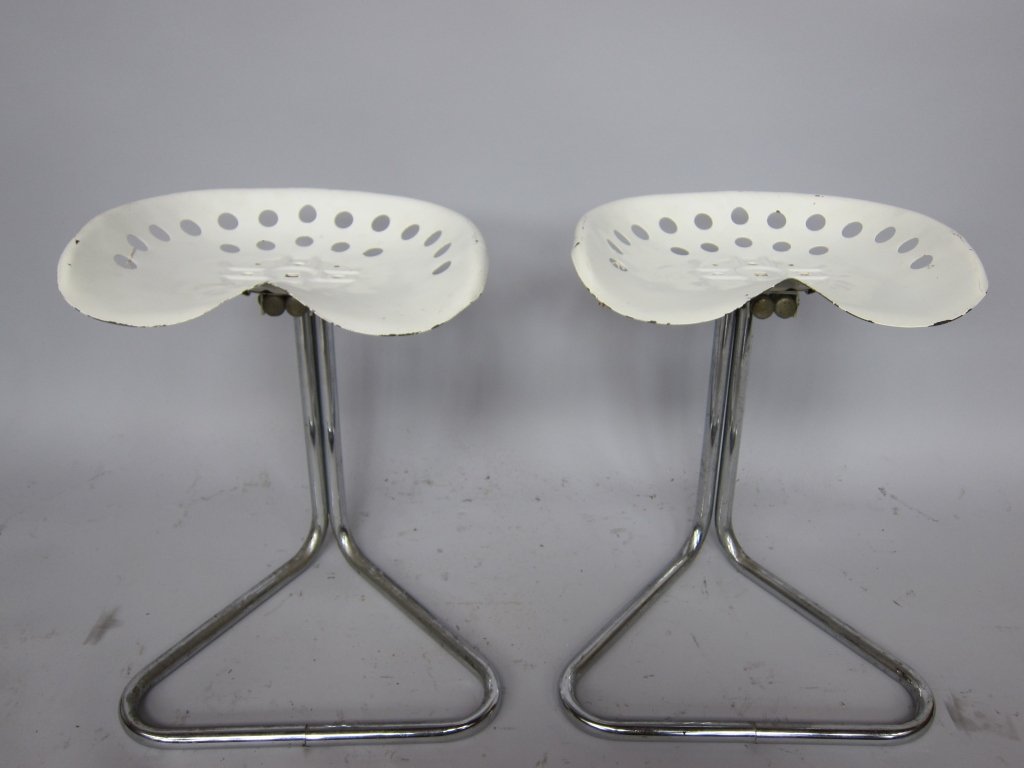 PAIR STOOLS: A pair 20th c. modern design tractor like stools. The shaped and conforming pierced white powder coated metal seats raised on chrome triangular bases. 22" H.