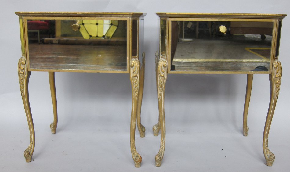 PAIR NIGHTSTANDS: A pair mid 20th c. modern design "Hollywood Regency" Italianate mirrored nightstands having chinoisserie floral eglomise side panels. Each raised on carved and gilt cabriole legs terminating on scroll