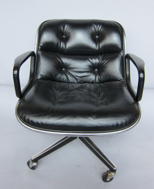 EAMES. CHARLES (1907-1978, American): A mid 20th c. modern swivel desk and armchair designed by Charles Eames for Knoll International. Labeled under seat. Button tufted black upholstery on steel frame with caster feet. 31" H.