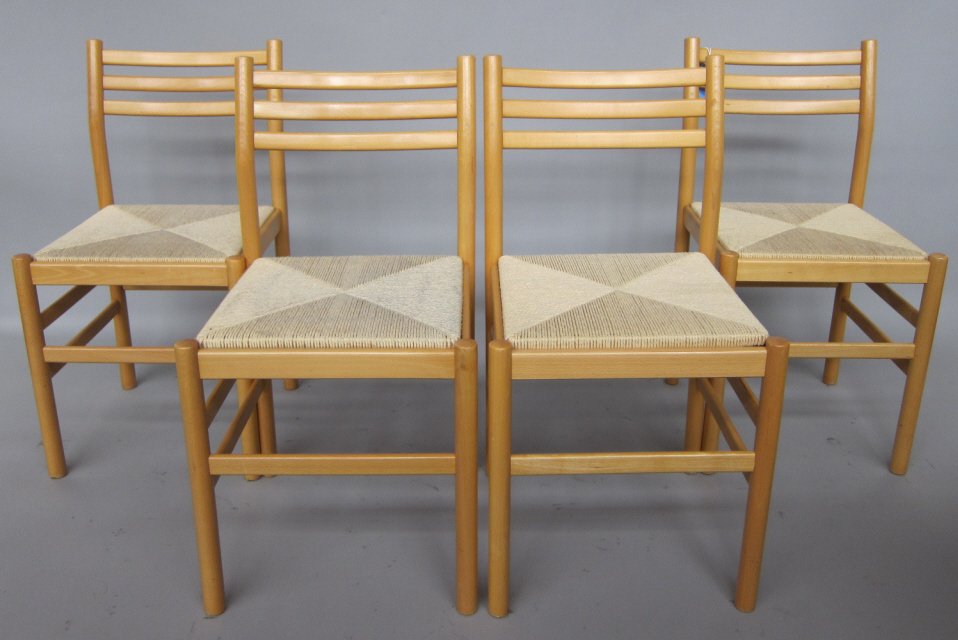 CHIAVARI CHAIRS: A set of four Italian Chiavari blonde wood dining side chairs, originally designed by Gio Ponti. Each fitted with a rush seat. Measures: 31.5"H., each. Pre-Sale Estimate: $100/200