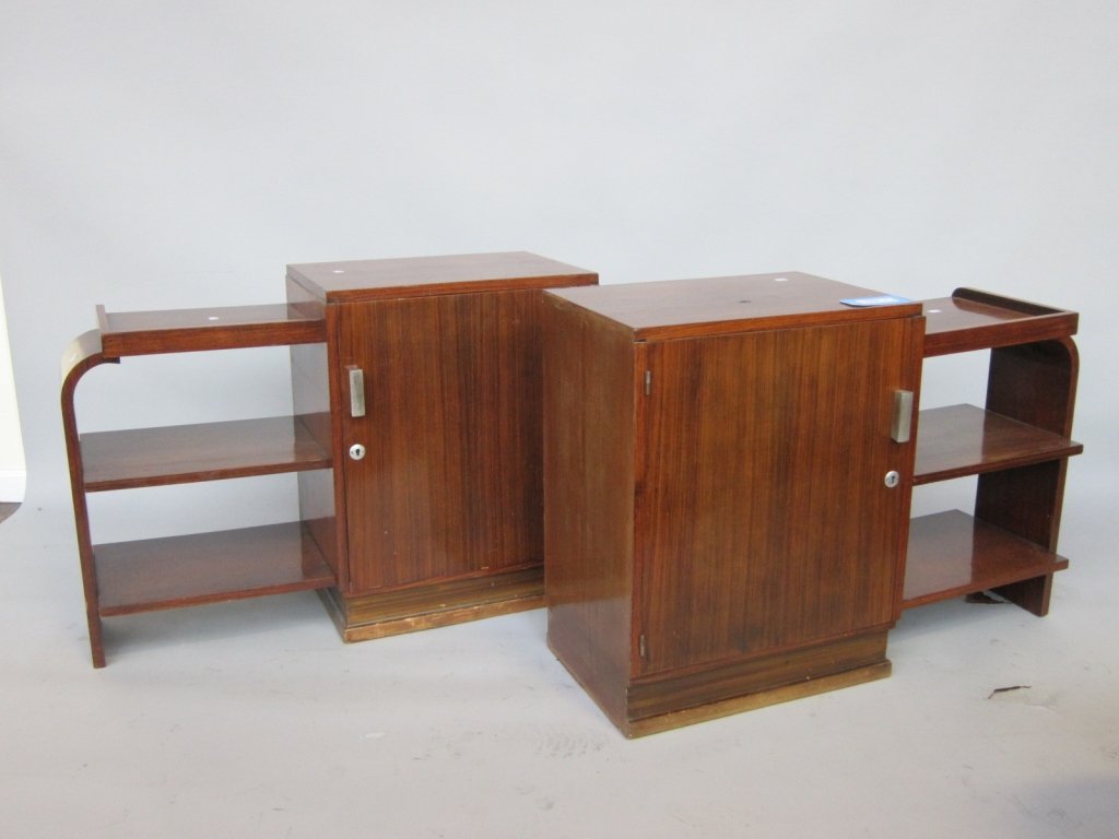 PAIR ART DECO NIGHTSTANDS: A pair 20th c. figured walnut waterfall cabinet night stands. Each having a single cabinet door flanked by 3 open shelves. 36" L, x 13.5" W. x 25.25" H. Provenance: A group of fine property from a Lar