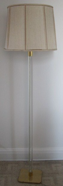 KARL SPRINGER: Karl Springer white column form floor lamp on a brass square form base. Provenance: Property from an exceptional Park Avenue, Manhattan, NY Estate.