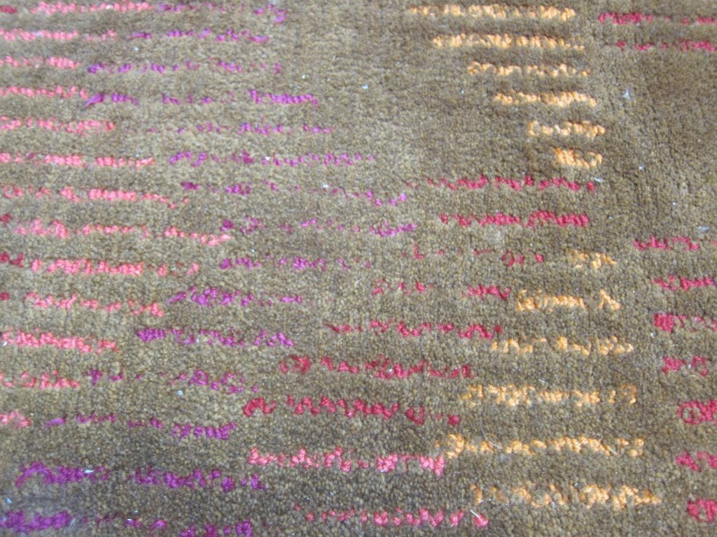 CARPET: A Mid-20th Century modern custom designed room size carpet produced by Edward Fields. Woven in gold with strips of red, pink and magenta. Measures: 10' W x13; L