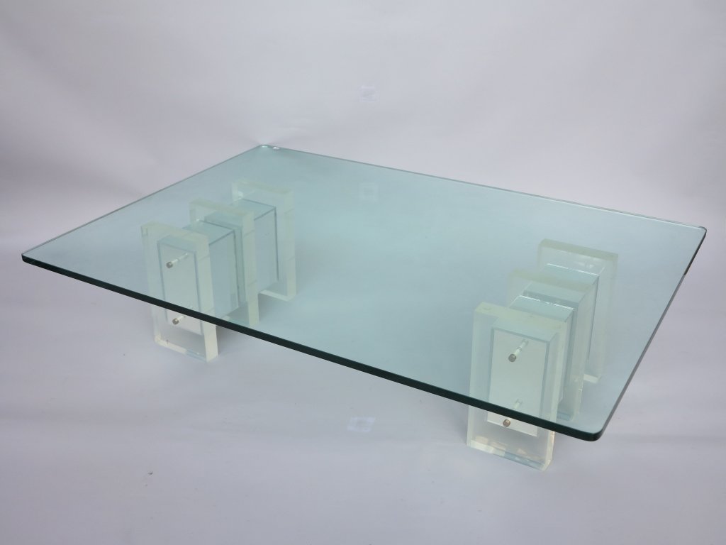COCKTAIL TABLE: A 20th century modern cocktail table, The rectangular glass top resting on a Lucite double block base having mirrored panels. 60" L x 42" W x 15.5" H