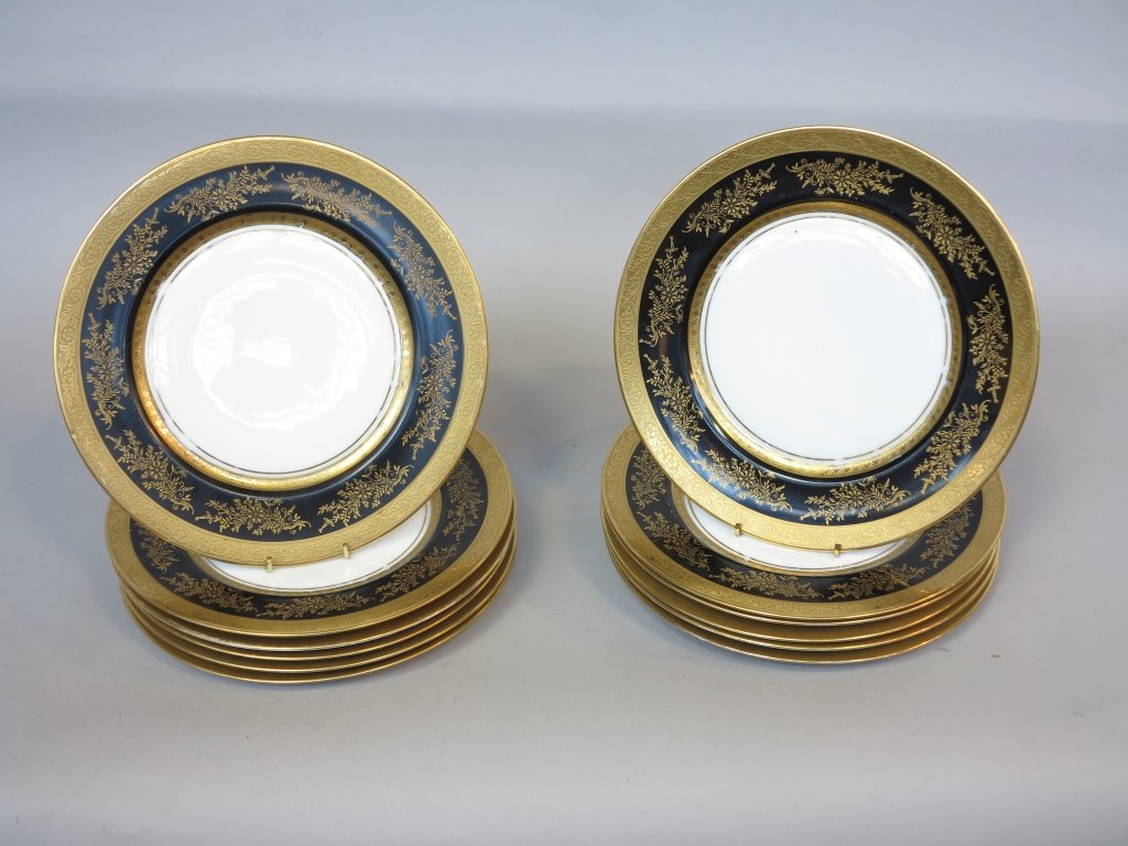 SET OF 12 HEINRICH BAVARIAN SERVICE PLATES: With gilt and black bands and gilt foliate decoration. Diam. 11." Some wear to inner gilt bands. Provenance: Property from a Larchmont New York Home.