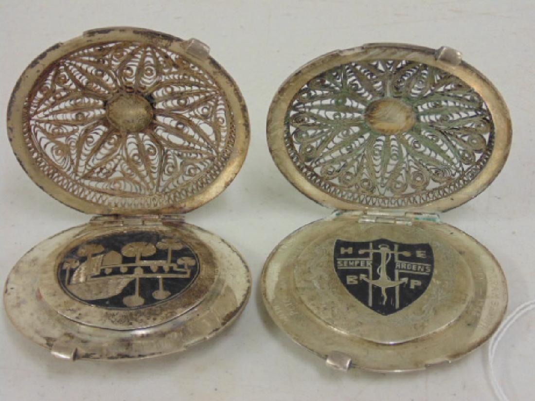 2 fine filigree compacts, Iran, Khorram Shar: 2 fine filigree decorated silver compacts, Persian (Iran, Khorram Shar), decorations on reverse, 2.75" in diameter. Please refer to images for general condition issues, all items sold in "as is" condi