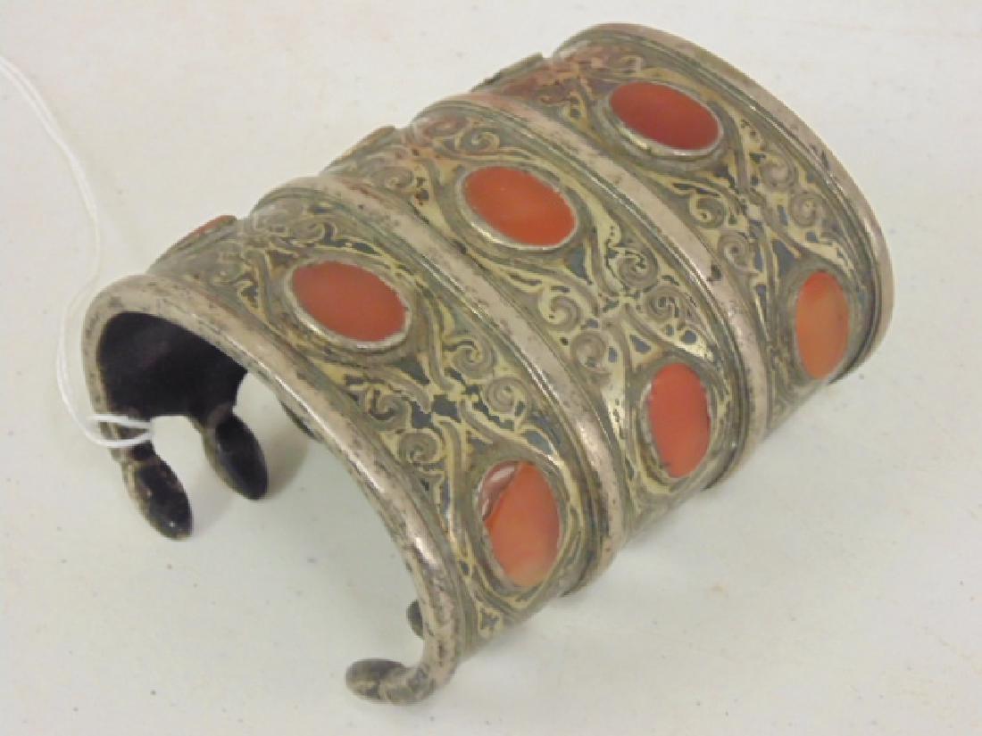 Silver cuff inlaid with stones: Silver cuff inlaid with stones, 3 3/8" long, intricate decoration. Please refer to images for general condition issues, all items sold in "as is" condition, all sales final, please see company website