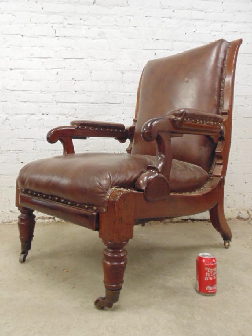 Adjustable leather mechanical recliner,: Adjustable leather recliner, carved mahogany, brown leather, chair is 40" tall (up position), 24" wide, depth varies, minor scratches. Please refer to images for general condition issues, all items so